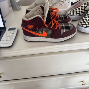 Kids Jordan 1 Mid SE Plaid Sneakers with Orange Accents